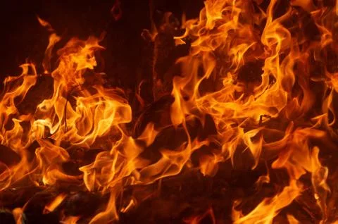 Flame of fire on a black background Stock Photos