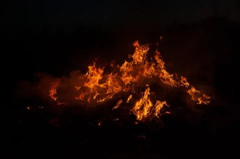 Flame of fire on a black background Stock Photos