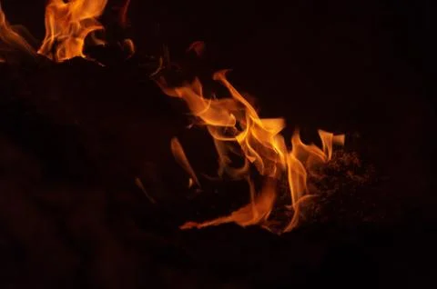 Flame of fire on a black background Stock Photos