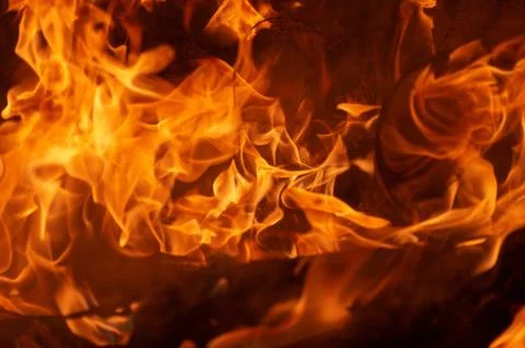 Flame of fire on a black background Stock Photos