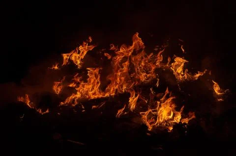 Flame of fire on a black background Stock Photos