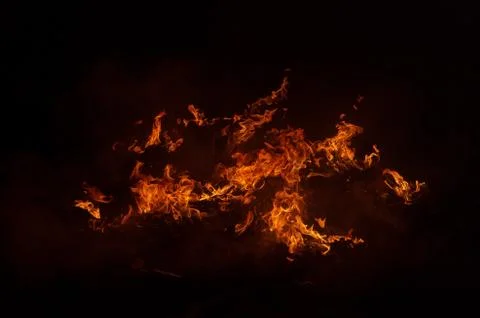 Flame of fire on a black background Stock Photos