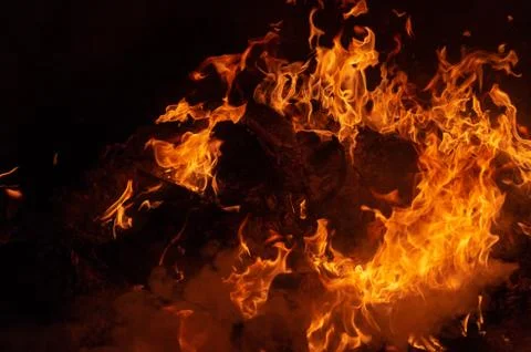 Flame of fire on a black background Stock Photos