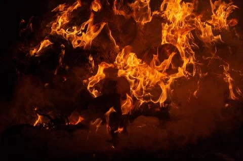 Flame of fire on a black background Stock Photos