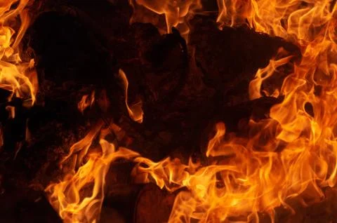 Flame of fire on a black background Stock Photos