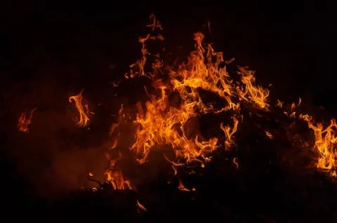 Flame of fire on a black background Stock Photos
