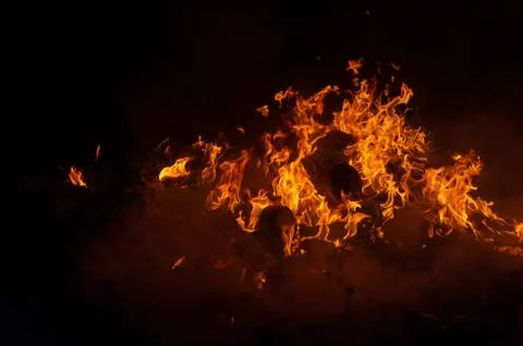 Flame of fire on a black background Stock Photos
