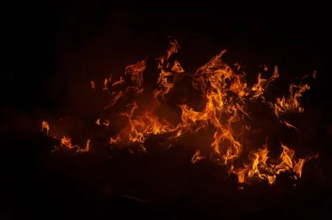 Flame of fire on a black background Stock Photos