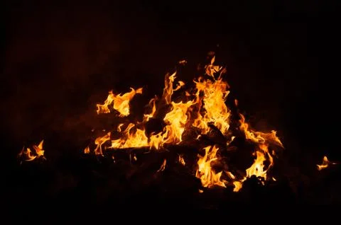 Flame of fire on a black background Stock Photos