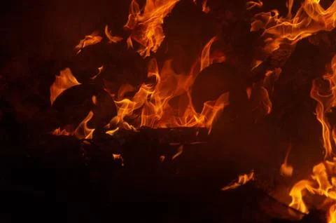 Flame of fire on a black background Stock Photos