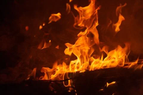 Flame of fire on a black background Stock Photos