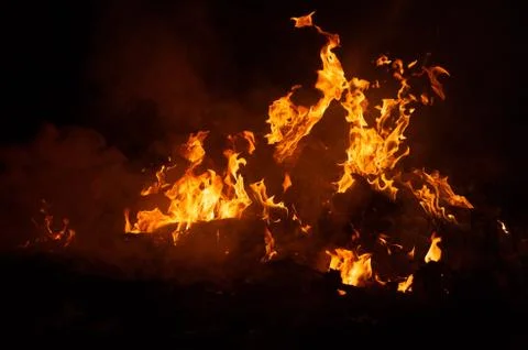 Flame of fire on a black background Stock Photos