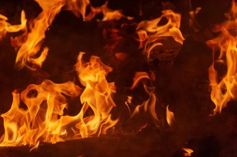 Flame of fire on a black background Stock Photos