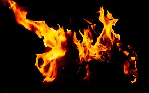 Flame of fire on a black background Stock Photos