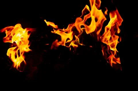 Flame of fire on a black background Stock Photos