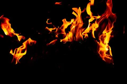 Flame of fire on a black background Stock Photos
