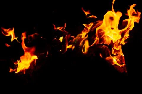 Flame of fire on a black background Stock Photos