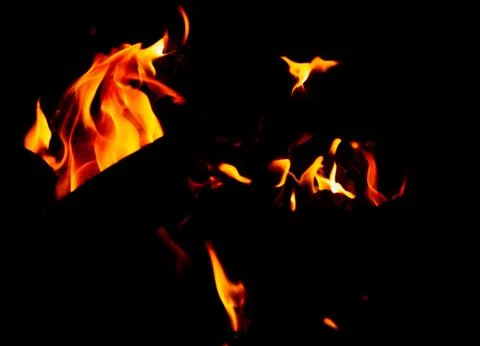 Flame of fire on a black background Stock Photos