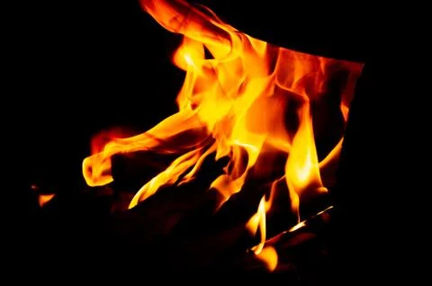 Flame of fire on a black background Stock Photos