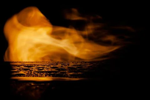 Flame of fire on a black background Stock Photos