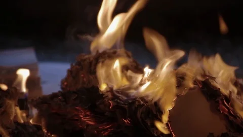 Flame of fire burns pile of documents associated with war and destruction Stock Footage 117994382