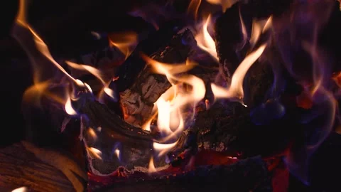A flame of fire with coals at night Stock Footage 318463831
