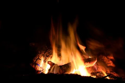 Flame of fire in darkness Stock Photos