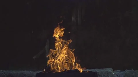 This is a flame of fire on a grunge background. Stockbeeldmateriaal 134350433