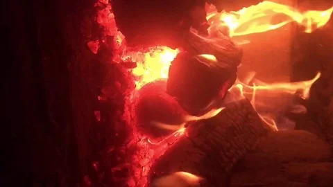 The flame of fire inside the Russian oven. Vertical video Stock Footage 123306199