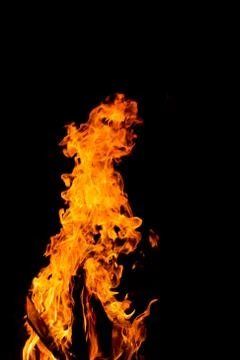 Flame of fire with sparks on a black background Stock Photos