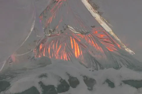 Flame of a fire through a piece of ice Stock Photos
