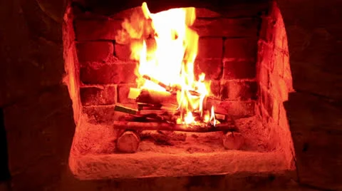 Flame in a fireplace with a dark background Stock Footage 23542858