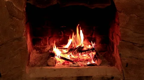 Flame in a fireplace with a dark background, Full HD Stock Footage