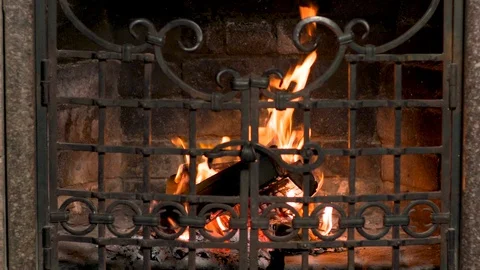 Flame in Fireplace iron grate. Warm Fire in home Stock Footage 96767691