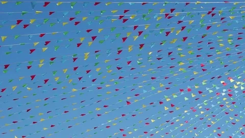 Flame flags colorful on blue sky background. Holiday background. Stock Footage 83095163