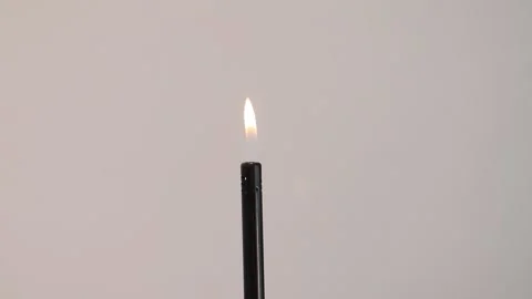 The flame flares up and the lighter turns on Stock Footage 231761847