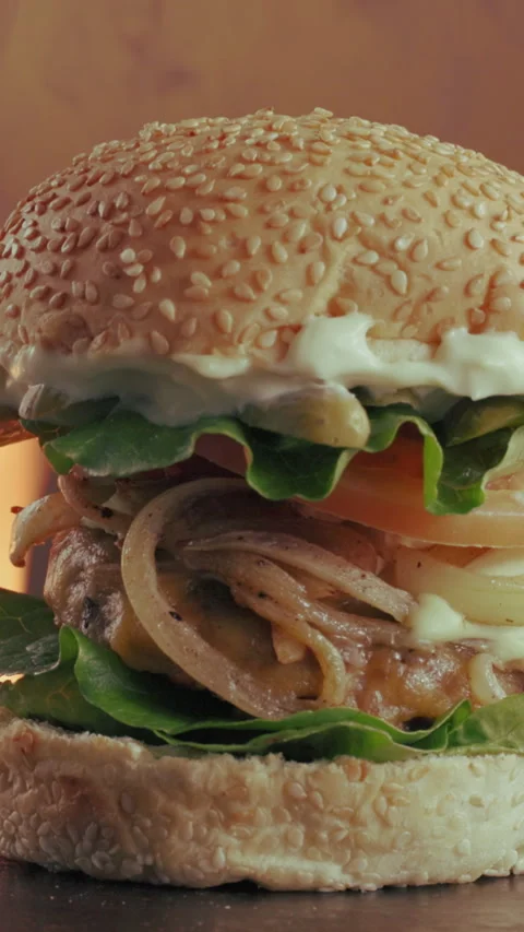 Flame, grill and hamburger in kitchen with fast food, cuisine serving or Stock Footage 340451808