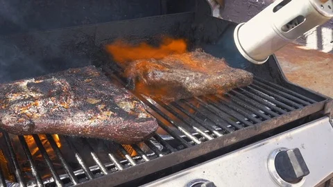 Flame Grilling Beef on a Barbecue Grill in Slow Motion Stock Footage 104163785