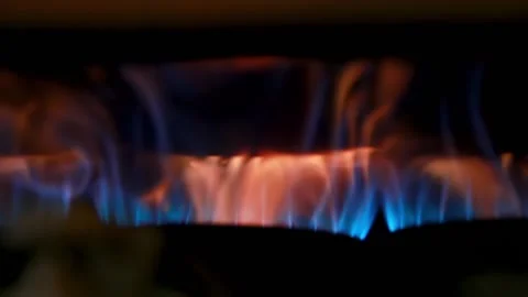Flame that is heating a coffee roaster, and with blue an orange flames Stock Footage 139946480