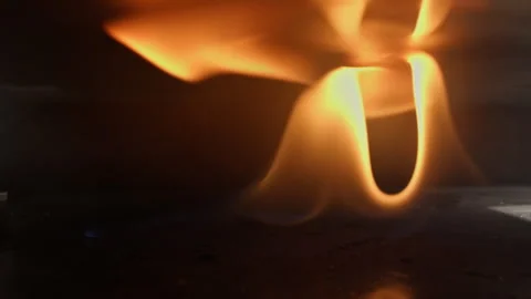 Flame igniting inside a gas oven 動画素材 323509658