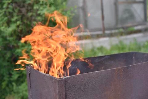 Flame in the iron box Stock Photos