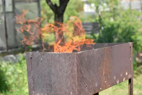 Flame in the iron box Stock Photos
