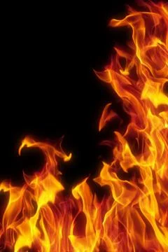 Flame isolated over black background Stock Photos