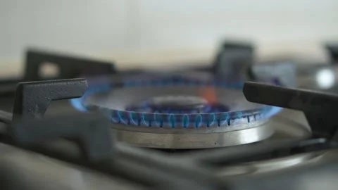 The flame of a kitchen burner. Burning gas flame on the stove. Turn on and off Stock-Footage 197682957