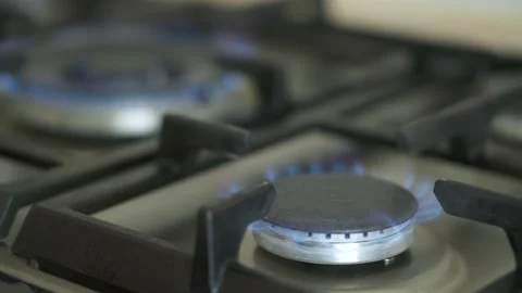 The flame of a kitchen burner. Burning gas flame on the stove. Turn on and off Stock Footage 198678446