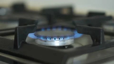 The flame of a kitchen burner. Burning gas flame on the stove. Turn on and off Stock Footage 201468445