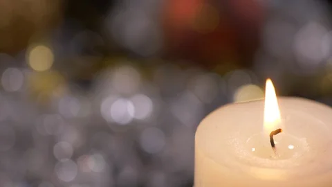 Flame Of A Lit  Candle Against The Background Of A Christmas Video stock 128819133