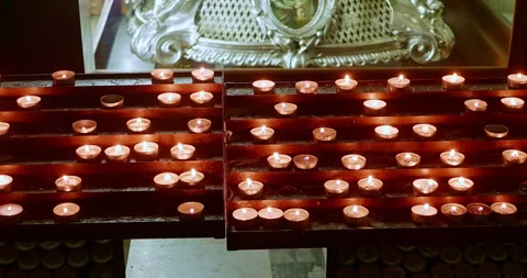 The flame of many lit candles in a Catholic church 動画素材 288344819