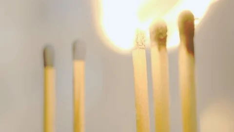 The flame of a match passes to the nearest one. Stock Footage 129426262