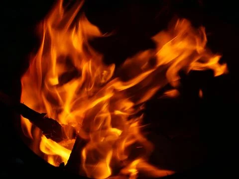 A flame in the night. Stock Photos